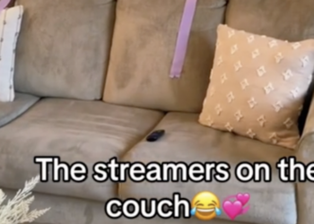 purple streamers draped casually on a couch